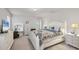 Bright main bedroom with ensuite bathroom and coastal-themed bedding at 4324 Knowles Ln, North Port, FL 34288