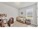 Office featuring a desk, cushioned chair, a daybed and a window providing natural light at 4324 Knowles Ln, North Port, FL 34288