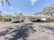Carport parking area with covered parking and landscaping at 435 Cerromar Ln # 326, Venice, FL 34293