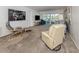 Spacious living room with plush carpet, comfortable seating, and sliding glass doors to the outside at 435 Cerromar Ln # 326, Venice, FL 34293