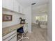 Dedicated office space with a granite desk, natural light, and easy access to the bedroom at 435 Cerromar Ln # 326, Venice, FL 34293