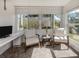 Cozy sitting area featuring bright light from two windows, modern decor, and comfortable seating at 435 Cerromar Ln # 326, Venice, FL 34293