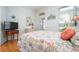 Inviting bedroom with wood floors and an accent window bringing in natural light at 456 Pinewood Lake Dr, Venice, FL 34285