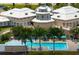 Pool and clubhouse with covered lounge area offers shaded seating at 456 Pinewood Lake Dr, Venice, FL 34285