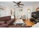 Comfortable living room featuring hardwood floors, stylish decor, and ample natural light, creating an inviting atmosphere at 456 Pinewood Lake Dr, Venice, FL 34285