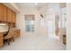 Office space features a built-in wooden desk and shelving with tiled floors at 456 Pinewood Lake Dr, Venice, FL 34285