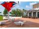 Outdoor restaurant with patio seating and shade structures; an inviting space to relax and dine al fresco at 456 Pinewood Lake Dr, Venice, FL 34285