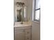 Bathroom with white sink, cabinet, and standard lighting at 460 Base E Ave # 129, Venice, FL 34285