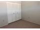 Bedroom featuring a closet with white bi-fold doors at 460 Base E Ave # 129, Venice, FL 34285