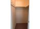 Walk-in closet with shelf and clothing rods ready for storage at 460 Base E Ave # 129, Venice, FL 34285