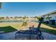 Outdoor patio area offering a peaceful spot to unwind and enjoy the lake views at 483 Circlewood Dr # O14, Venice, FL 34293