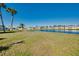 Backyard with access to a serene lake, perfect for enjoying the natural surroundings at 483 Circlewood Dr # O14, Venice, FL 34293