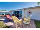Backyard patio with comfortable seating and a serene setting for outdoor entertainment and relaxation at 483 Circlewood Dr # O14, Venice, FL 34293