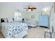 Comfortable bedroom with twin beds, complemented by beach-themed decor and a blue cabinet at 483 Circlewood Dr # O14, Venice, FL 34293