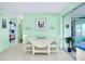 Bright dining area with a drop leaf table and coastal decor for a relaxing, beachy vibe at 483 Circlewood Dr # O14, Venice, FL 34293
