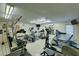 Well-equipped exercise room with treadmills, ellipticals, and weight machines for a complete workout at 483 Circlewood Dr # O14, Venice, FL 34293