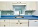 The kitchen features stainless steel sink, mosaic tile backsplash and plenty of cabinet space at 483 Circlewood Dr # O14, Venice, FL 34293