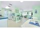 Inviting view of the kitchen flowing into the open living room, flooded with natural light at 483 Circlewood Dr # O14, Venice, FL 34293