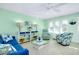 Cozy living room with comfortable seating, beach-themed decor, and bright, cheerful ambiance at 483 Circlewood Dr # O14, Venice, FL 34293