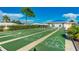 Well-maintained shuffleboard courts for outdoor fun and recreation on a beautiful sunny day at 483 Circlewood Dr # O14, Venice, FL 34293
