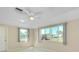 Sunlit bedroom with large windows offering serene neighborhood views at 49 Sandstone Cir, Venice, FL 34293
