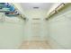 Walk-in closet with built-in shelving and ample storage space for clothes and accessories at 49 Sandstone Cir, Venice, FL 34293