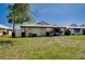 Cozy single-story home with a well-maintained lawn and charming landscaping, creating a welcoming curb appeal at 49 Sandstone Cir, Venice, FL 34293