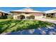 Inviting single-Gathering home featuring an attached garage and lush green lawn in a serene neighborhood setting at 49 Sandstone Cir, Venice, FL 34293
