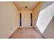 Inviting entryway showcasing a white door with sidelights and tile flooring at 49 Sandstone Cir, Venice, FL 34293