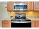 Kitchen featuring stainless steel appliances and granite countertops at 49 Sandstone Cir, Venice, FL 34293