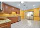 Eat-in kitchen features stainless steel appliances, granite countertops, and sliding glass doors at 49 Sandstone Cir, Venice, FL 34293