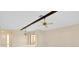 Bright living room with decorative ceiling beams and sliding glass doors at 49 Sandstone Cir, Venice, FL 34293