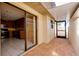 Covered patio area with brick flooring and access to indoor kitchen at 49 Sandstone Cir, Venice, FL 34293