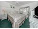 Bright bedroom featuring wicker furniture, white walls, and a charming bay window at 503 Clubside Cir # 47, Venice, FL 34293