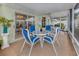 Covered patio with a table and chairs, perfect for outdoor entertaining or relaxing at 503 Clubside Cir # 47, Venice, FL 34293