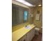 Bright bathroom with a large mirror, and an extended vanity area and a shower at 508 Vasto Dr, Venice, FL 34285