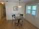 Breakfast nook featuring small table, two chairs and view of the outside at 508 Vasto Dr, Venice, FL 34285