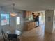 Bright kitchen featuring tile flooring, wood cabinets and black appliances offers ample counter space at 508 Vasto Dr, Venice, FL 34285
