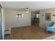Open layout showcasing living area, with a view of the dining room, with ample wall space at 508 Vasto Dr, Venice, FL 34285