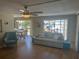 Inviting living room with a view into the dining area, featuring a comfortable sofa and plenty of natural light at 508 Vasto Dr, Venice, FL 34285