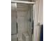 Modern shower with sliding glass doors and silver accents at 508 Vasto Dr, Venice, FL 34285
