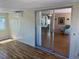 Light-filled sunroom with laminate flooring leads to a view of the living room at 508 Vasto Dr, Venice, FL 34285