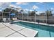 Inviting screened pool area with clear blue water and comfortable lounge seating surrounded by privacy fence at 509 Alhambra Rd, Venice, FL 34285