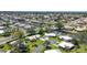 Aerial view of waterfront homes, docks, and canal access in a quiet residential area at 51 Oakwood N Dr # 51, Englewood, FL 34223