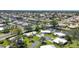 Aerial view of waterfront homes, docks, and canal access in a quiet residential area at 51 Oakwood N Dr # 51, Englewood, FL 34223