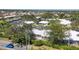 Aerial view of residential area, highlighting beautiful landscaping and nearby waterways at 51 Oakwood N Dr # 51, Englewood, FL 34223