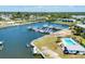 Aerial view of waterfront property with boat docks and community pool at 51 Oakwood N Dr # 51, Englewood, FL 34223