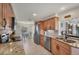 Stylish kitchen equipped with granite countertops, stainless steel appliances, and ample cabinet space at 51 Oakwood N Dr # 51, Englewood, FL 34223
