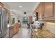 Updated kitchen featuring modern appliances, custom cabinets, and granite countertops at 51 Oakwood N Dr # 51, Englewood, FL 34223