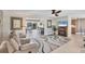 Spacious living room offering comfortable seating and open access to outdoor entertainment area at 51 Oakwood N Dr # 51, Englewood, FL 34223